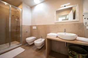 Koupelna v ubytování Apart-Hotel la Rocchetta