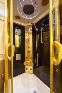 a bathroom with a shower and a tub in a room at Hostel Suputnyk in Lviv