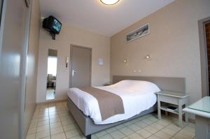 Säng eller sängar i ett rum på Hotel De Golf