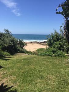 a view of a beach with the ocean in the background at Shelly Beach, Villa Albatross 2 in Shelly Beach