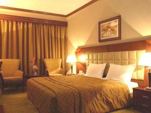 Postel nebo postele na pokoji v ubytování Grand Central Hotel