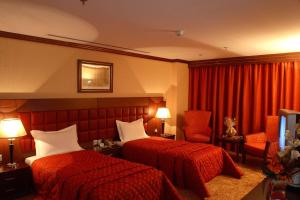 Postel nebo postele na pokoji v ubytování Grand Central Hotel