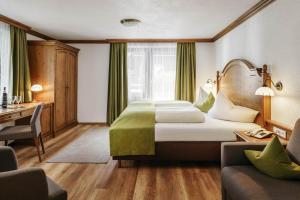 Postel nebo postele na pokoji v ubytování Hotel Haymon