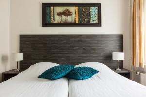 Ein Bett oder Betten in einem Zimmer der Unterkunft Fletcher Hotel Restaurant De Eese