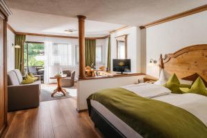 Postel nebo postele na pokoji v ubytování Hotel Haymon