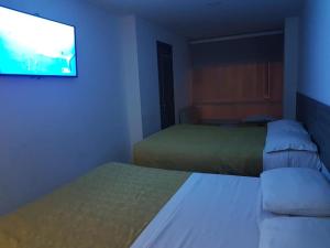 Postel nebo postele na pokoji v ubytování A Bogota On Holidays by Open - HOTEL CAS-EMBAJADA AMERICANA
