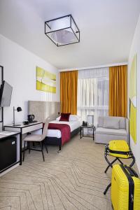 Posteľ alebo postele v izbe v ubytovaní Arche Hotel Krakowska