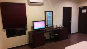 TV a/nebo společenská místnost v ubytování Cheng Ho Hotel + 37 fotografií