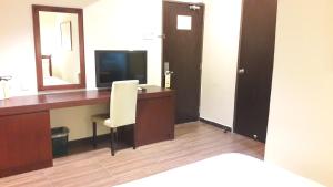 TV a/nebo společenská místnost v ubytování Cheng Ho Hotel