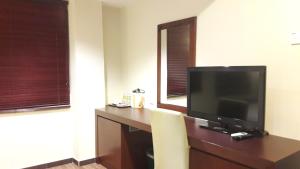 TV a/nebo společenská místnost v ubytování Cheng Ho Hotel