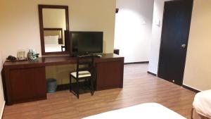 TV a/nebo společenská místnost v ubytování Cheng Ho Hotel