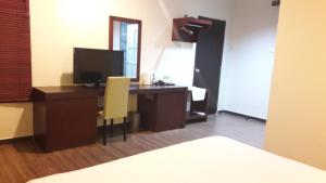 TV a/nebo společenská místnost v ubytování Cheng Ho Hotel
