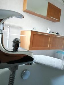 a roll of toilet paper sitting on a bathroom sink at Casa vacanze villa Pellegrino in Salerno +36 photos