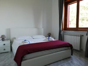 Lova arba lovos apgyvendinimo įstaigoje Casa vacanze villa Pellegrino