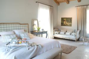 a bedroom with a bed with a tray of food on it at La Casa de los Tomillares in Candeleda
