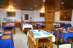 A restaurant or other place to eat at Swamy Hotel