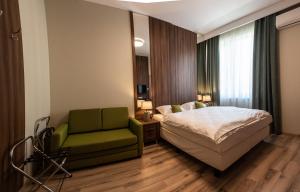 Posteľ alebo postele v izbe v ubytovaní Metropolis Apartamenty Centrum
