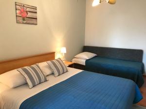 Postel nebo postele na pokoji v ubytování Apartmani Stula