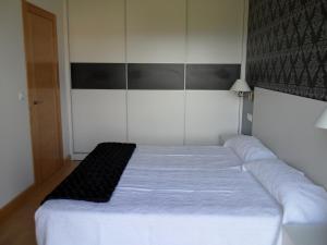 Кровать или кровати в номере Apartamentos Turisticos Estrella del Alemar