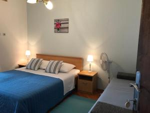 Postel nebo postele na pokoji v ubytování Apartmani Stula