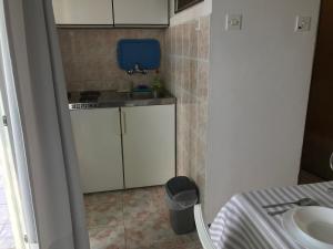 Kuchyň nebo kuchyňský kout v ubytování Apartmani Stula