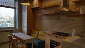 Kuchyňa alebo kuchynka v ubytovaní Soprano Apartment Tamanska