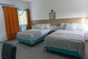 Postel nebo postele na pokoji v ubytování Hacienda bambú