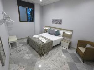 Ліжко або ліжка в номері Apartamento Capuchinos Cordoba