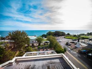 a view of a city with the ocean in the background at The Portland Hotel in Folkestone