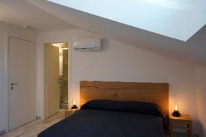 A bed or beds in a room at Approdo 36