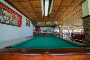 a pool table in the middle of a room at Bataan White Corals Beach Resort in Morong