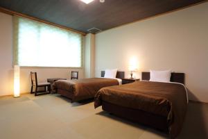 Postel nebo postele na pokoji v ubytování Hotel Oak Forest