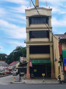 a tall building with a sign on the side of it at Hotel Sri Raub in Raub