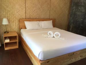 Postel nebo postele na pokoji v ubytování Bangbaobeach Resort