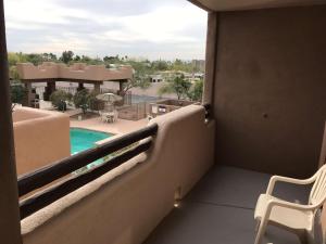 a balcony with a view of a swimming pool at Best Western Apache Junction Inn in Apache Junction