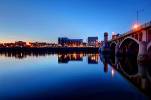a bridge over a river with a city in the background at Fairfield by Marriott Inn & Suites Haverhill in Haverhill