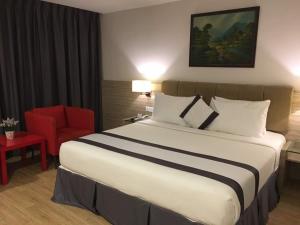 Postel nebo postele na pokoji v ubytování NU Hotel @ KL Sentral