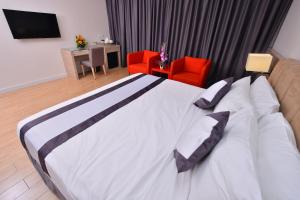 Postel nebo postele na pokoji v ubytování NU Hotel @ KL Sentral