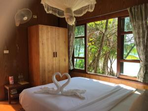 Postel nebo postele na pokoji v ubytování Bangbaobeach Resort