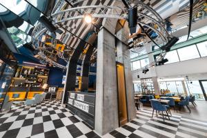 a view of a restaurant with a checkered floor at D8 Hotel in Budapest
