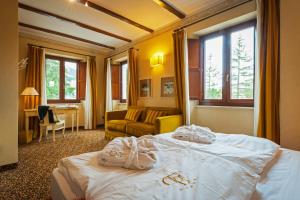 Postel nebo postele na pokoji v ubytování Relais Ducale Spa & Pool