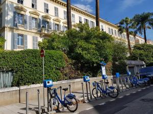 a row of blue bikes parked next to a building at Residence Blue Harmony in Nice