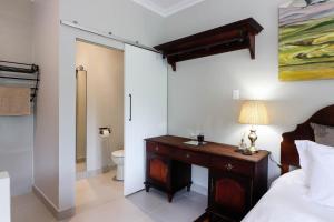 Ett badrum på Arbour1 Guesthouse