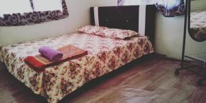 Postel nebo postele na pokoji v ubytování Sarifah homestay
