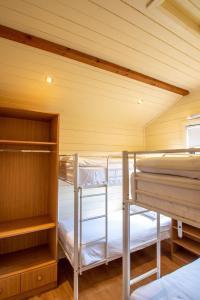 a room with three bunk beds in a room at Drumhoney Holiday Park in Enniskillen