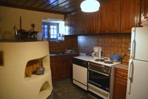 Kuchyň nebo kuchyňský kout v ubytování Petroto house