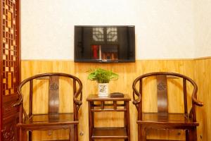平遥家信农家乐客栈的电视和/或娱乐中心