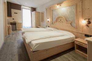 Katil atau katil-katil dalam bilik di Hotel Garni My Ledro