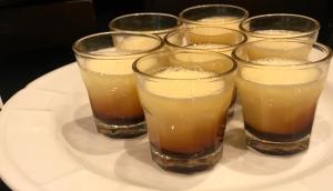 a plate with a group of glasses on a plate at Hotel Principe di Piemonte in Rimini