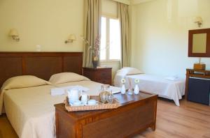 מיטה או מיטות בחדר ב-Hotel Karthea